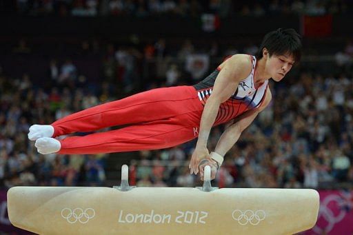Japan's gymnast Kohei Uchimura competes on the pommel horse